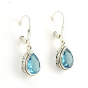 Side View Sterling Silver Blue Topaz 7x10mm Tear Bali Dangle Earrings