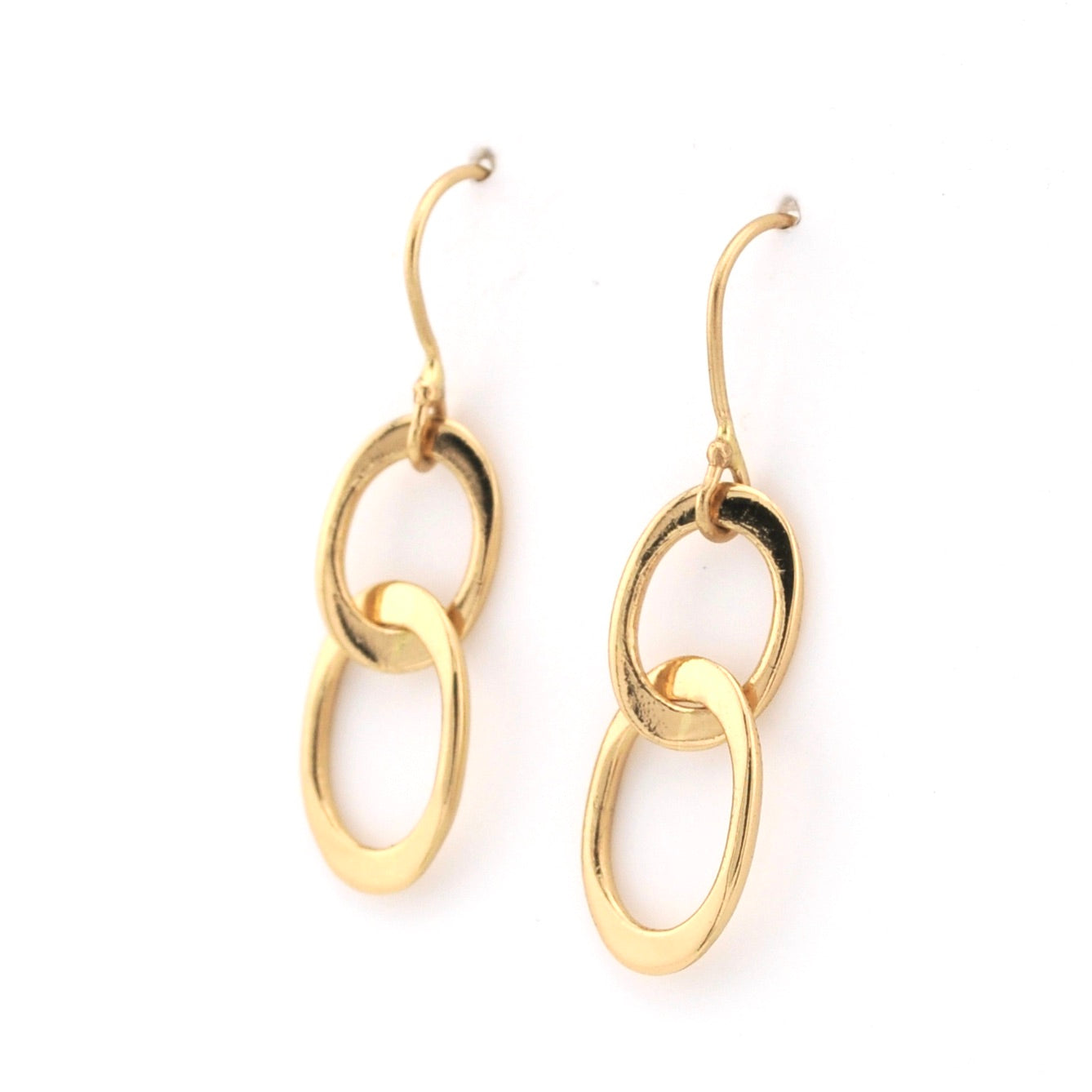 Gold hoop earrings on a white background