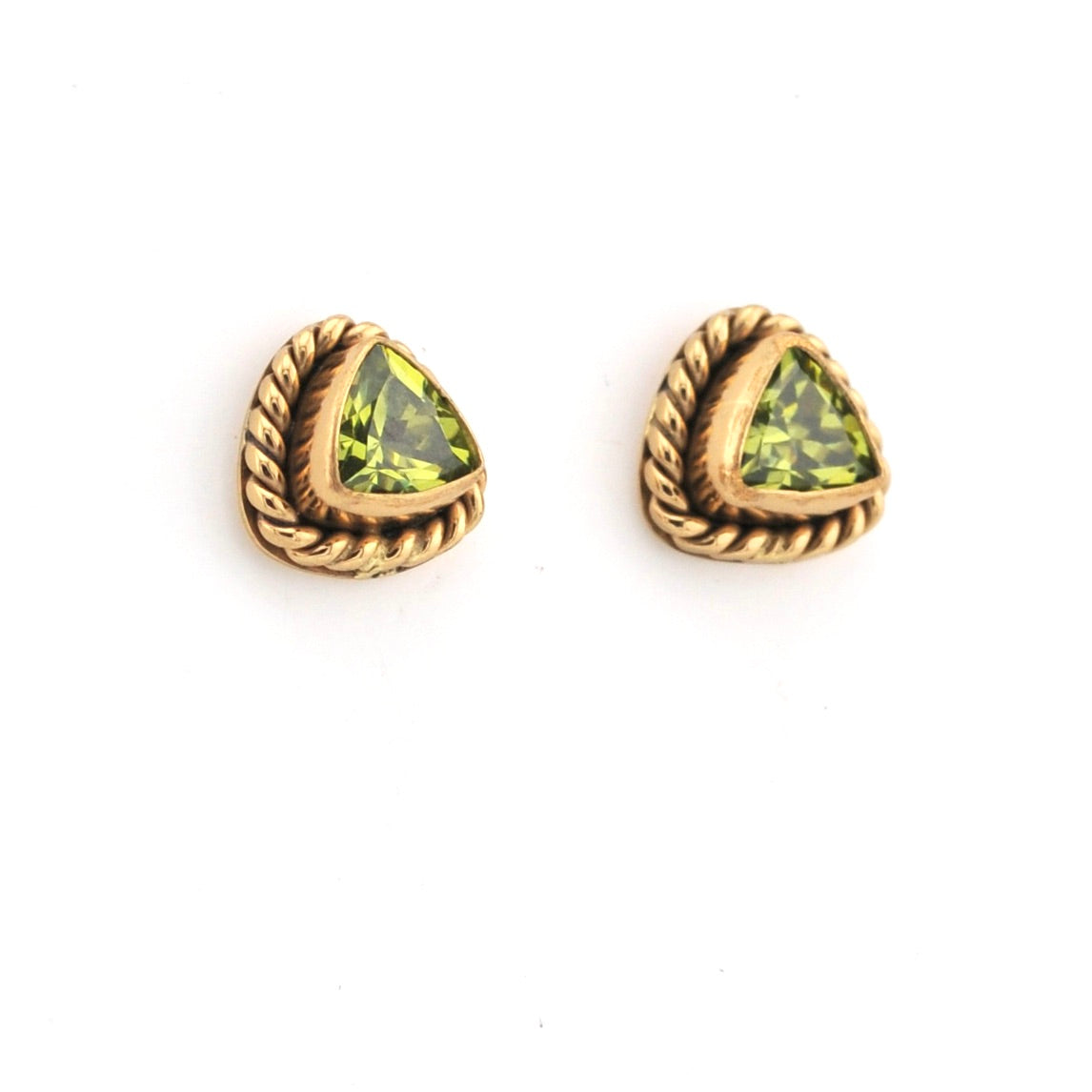 Gold-trimmed green gemstone earrings on a white background