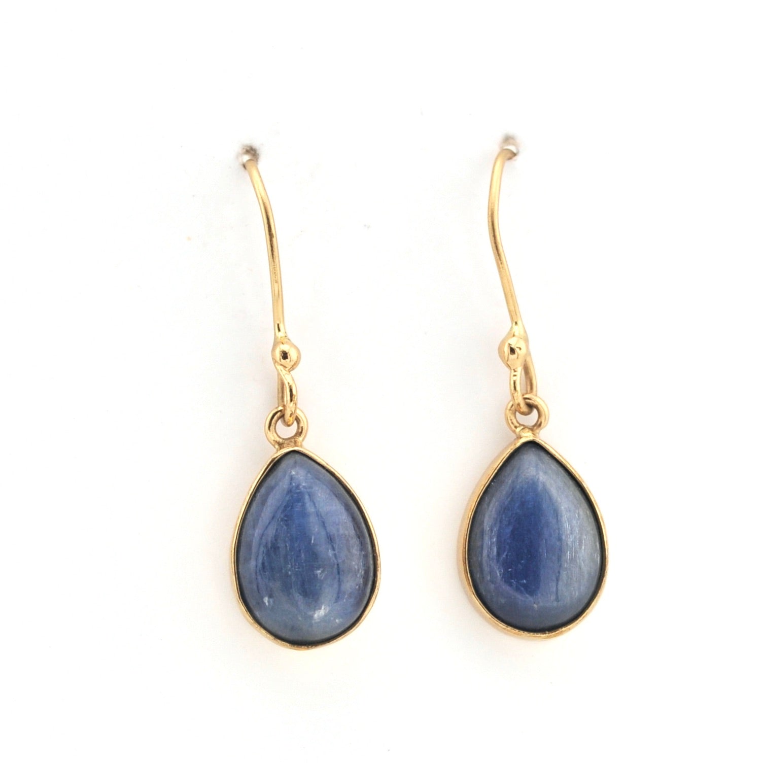 Gold earrings with blue teardrop-shaped stones on a white background