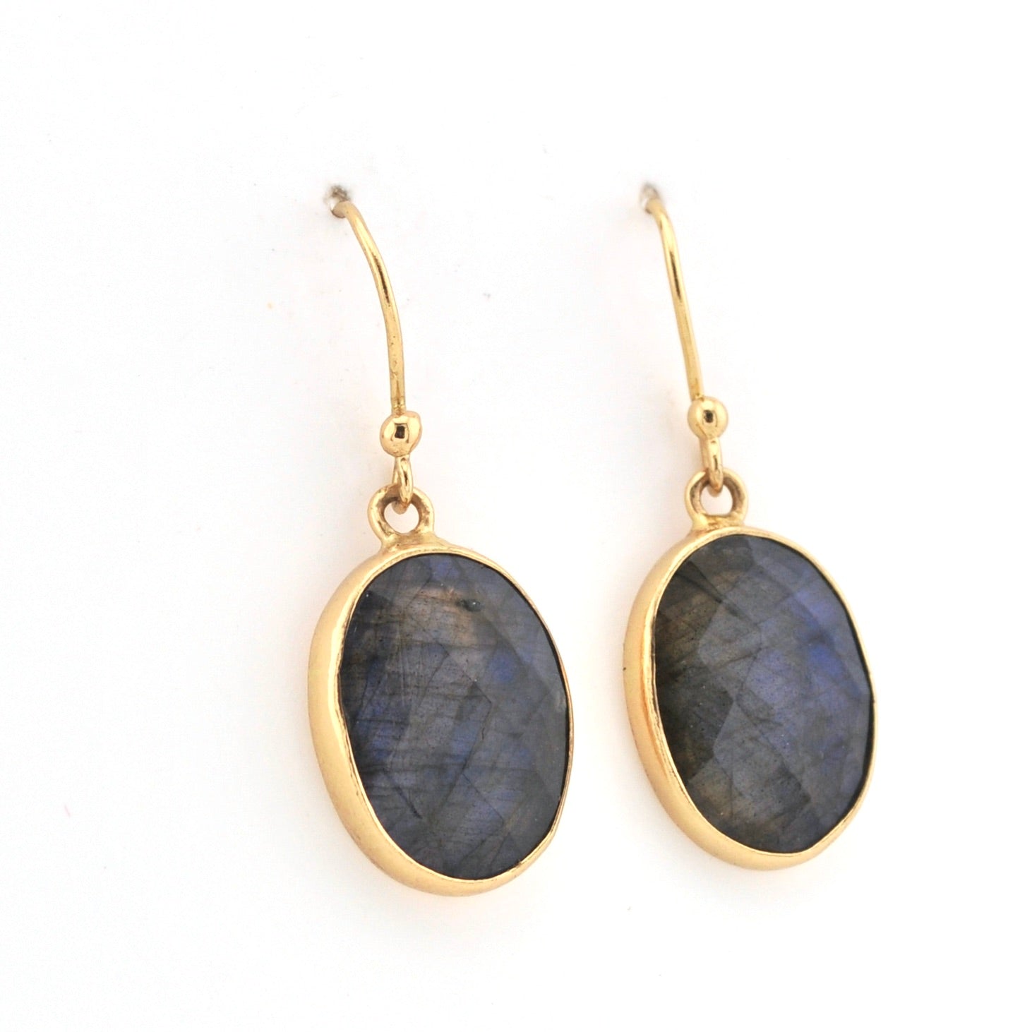 Gold earrings with Labradorite stones on a white background
