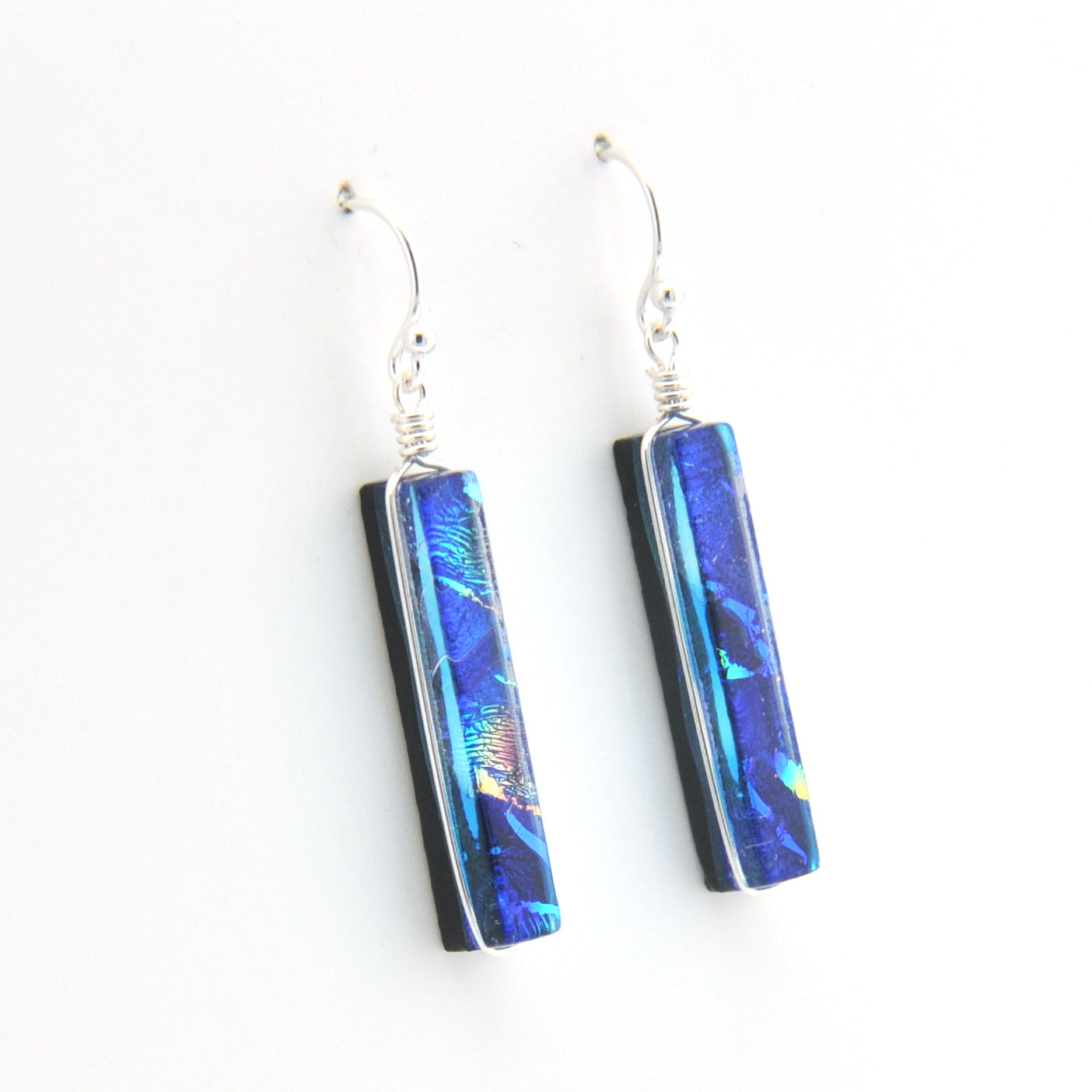Blue and black rectangle earrings on a white background