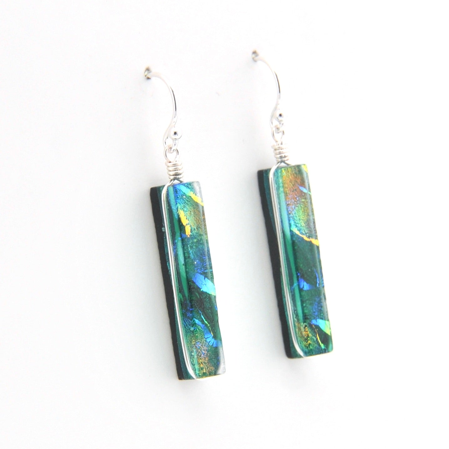 Pair of earrings with colorful rectangular beads on a white background