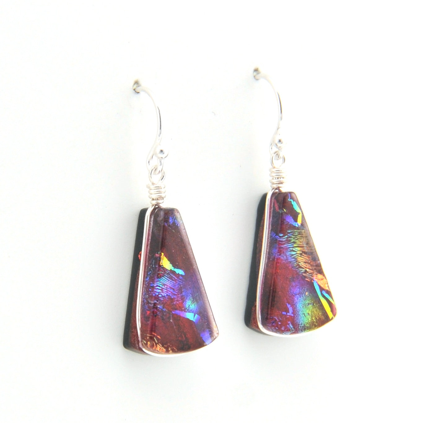 Multicolored teardrop earrings on a white background