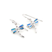 Silver dragonfly earrings with blue accents on a white background