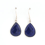 Pair of blue teardrop earrings on a white background