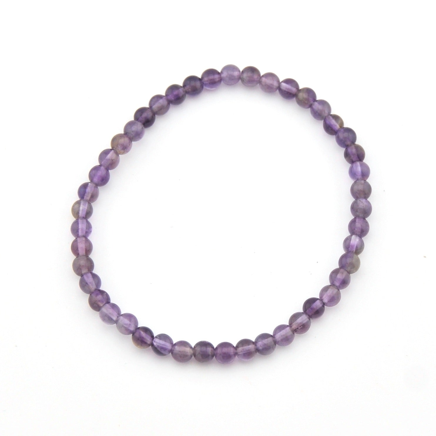Purple beaded bracelet on a white background