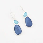 Blue teardrop earrings on a white background