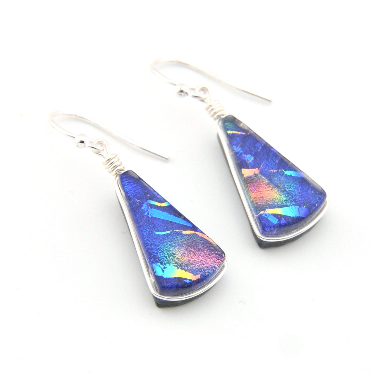 Teardrop-shaped earrings with colorful iridescent finish on a white background