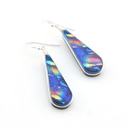 Teardrop-shaped earrings with colorful iridescent finish on a white background
