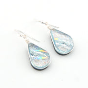Teardrop-shaped earrings with iridescent finish on a white background