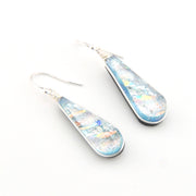 Teardrop-shaped earrings with a multicolored design on a white background