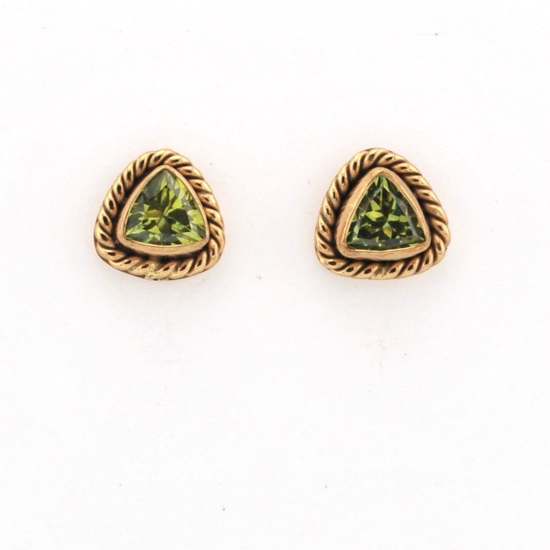Pair of gold-trimmed green gemstone earrings on a white background
