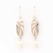 Pair of earrings with gold and pearl design on a white background