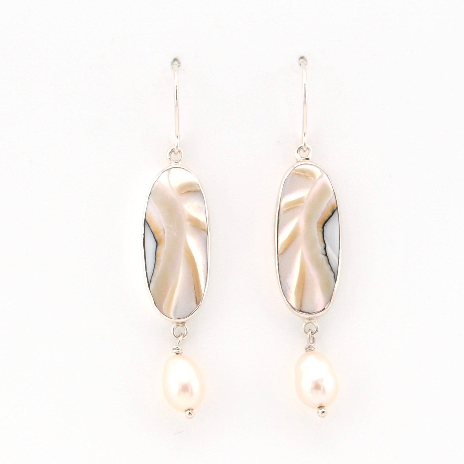 Pair of earrings with gold and pearl design on a white background