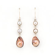 Pair of pearl earrings with a white background