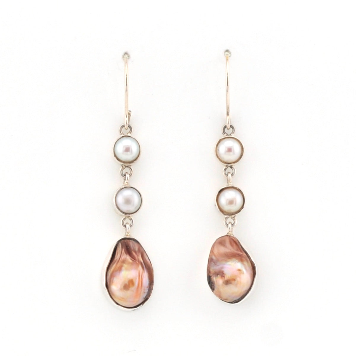 Pair of pearl earrings with a white background