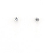 Pair of diamond stud earrings on a white background