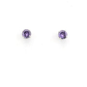 Pair of purple gemstone stud earrings on a white background