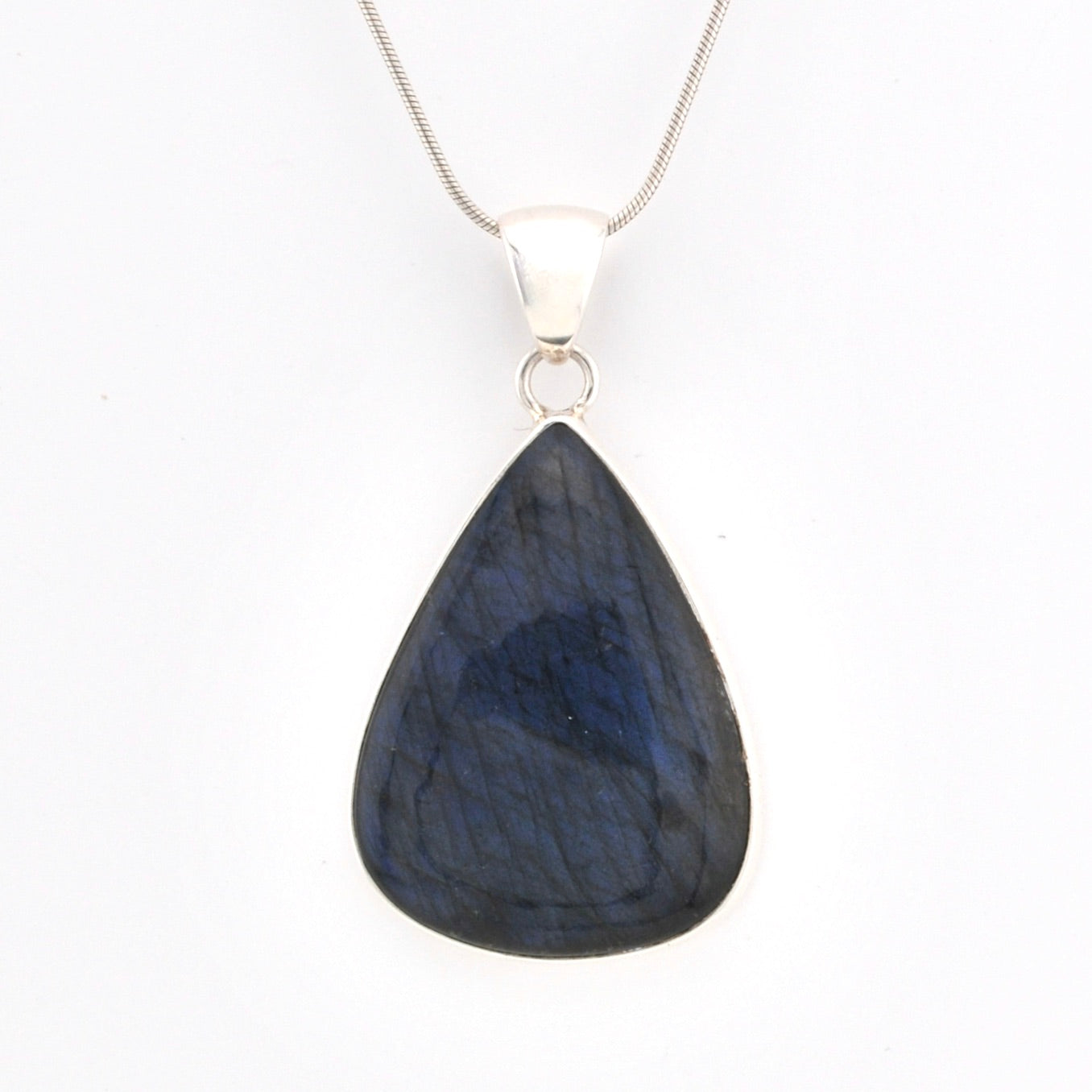 Teardrop-shaped blue pendant on a white background