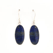 Pair of blue oval earrings on a white background