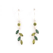 Green leaf-shaped earrings on a white background