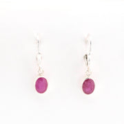 Front View Silver Ruby 5x7mm Oval Dangle Earrings