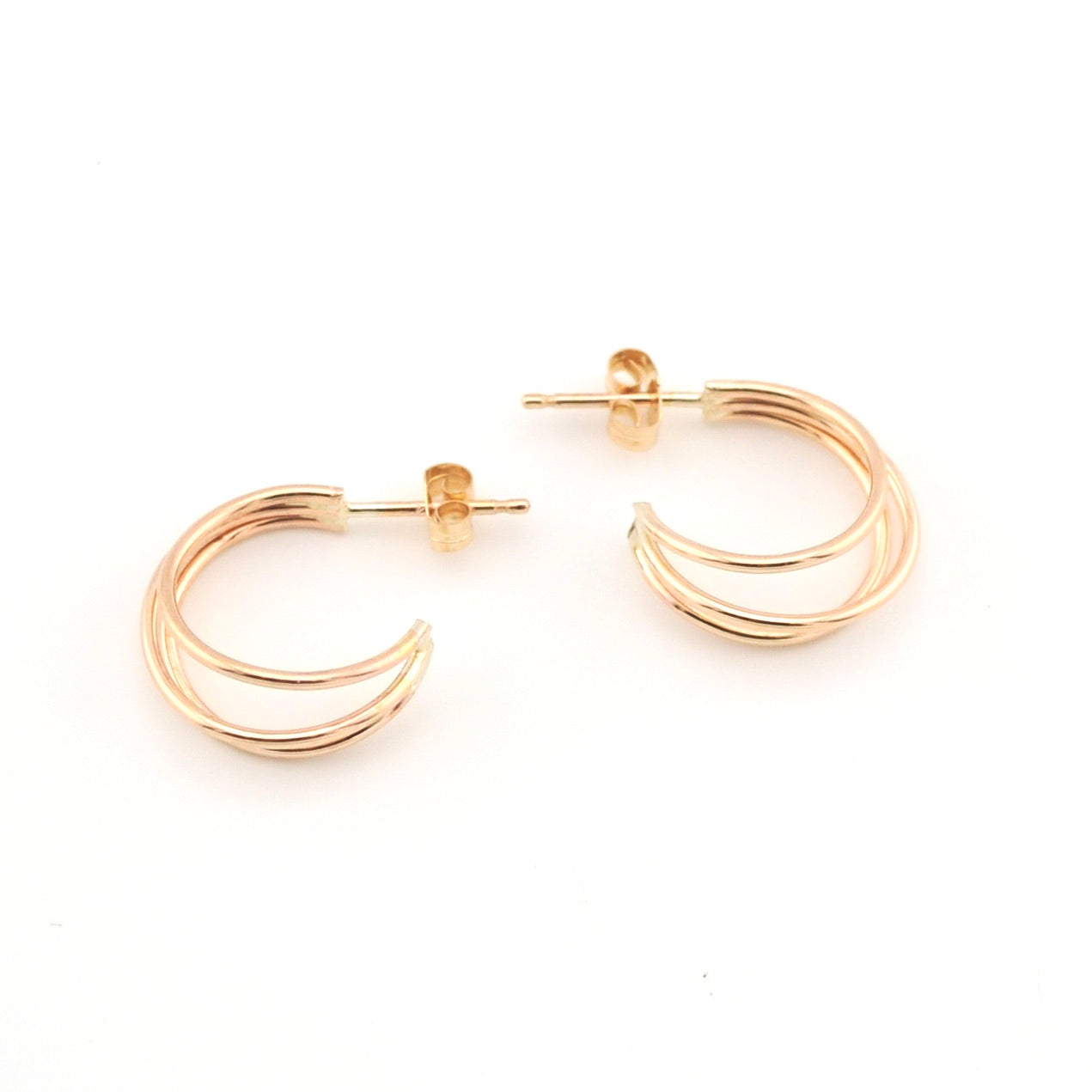 Gold hoop earrings on a white background