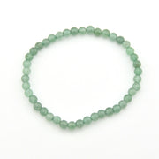 Green beaded bracelet on a white background