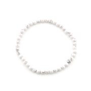 White beaded bracelet on a white background