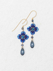 Pair of blue flower-shaped earrings with teardrop beads on a white background