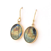 Gold earrings with Labradorite stones on a white background