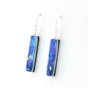 Pair of blue iridescent earrings on a white background