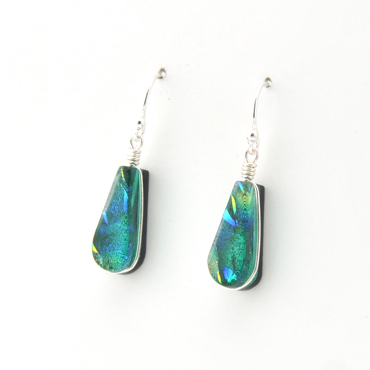 Teardrop-shaped earrings with multicolored stones on a white background