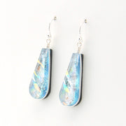 Teardrop-shaped earrings with blue and silver design on a white background