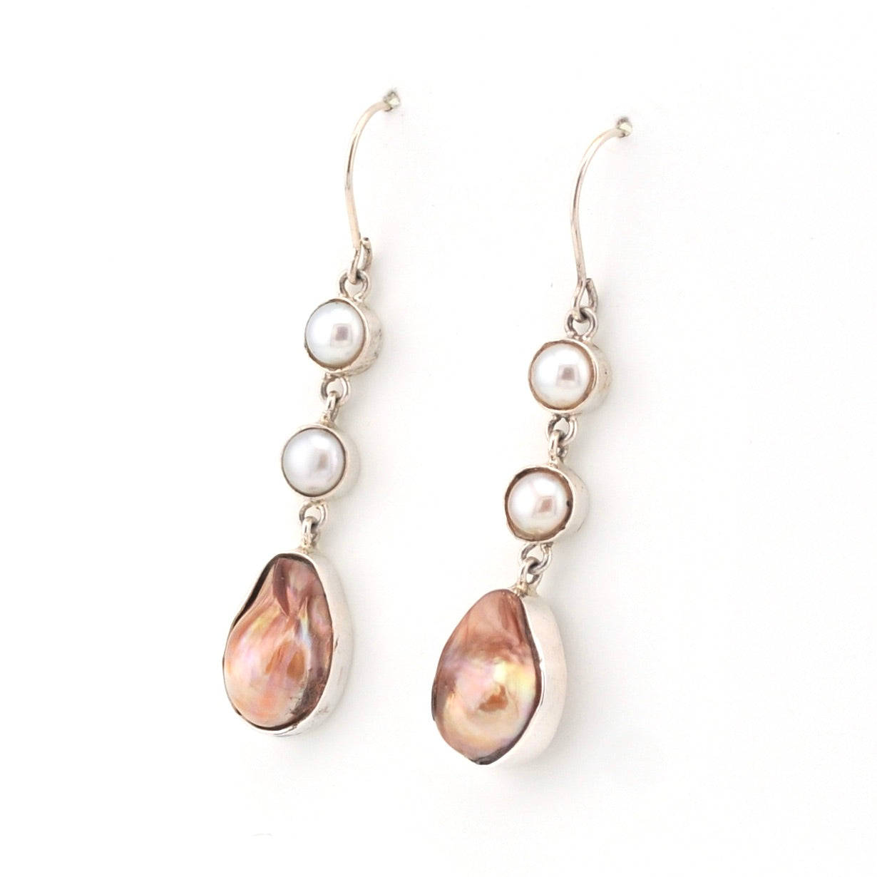 Pair of pearl earrings with teardrop-shaped pearls on a white background