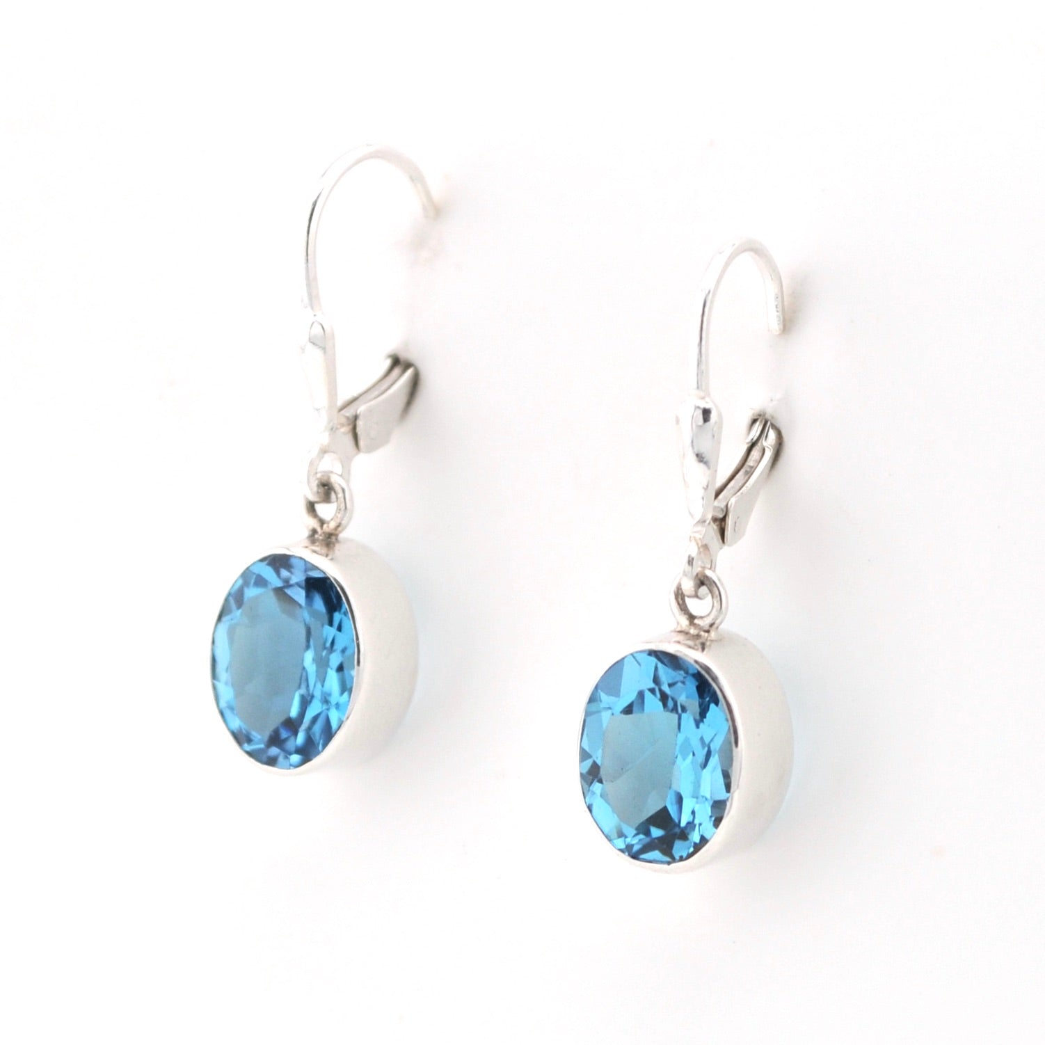 Side View Silver Blue Topaz 8x10mm Oval Dangle Earrings