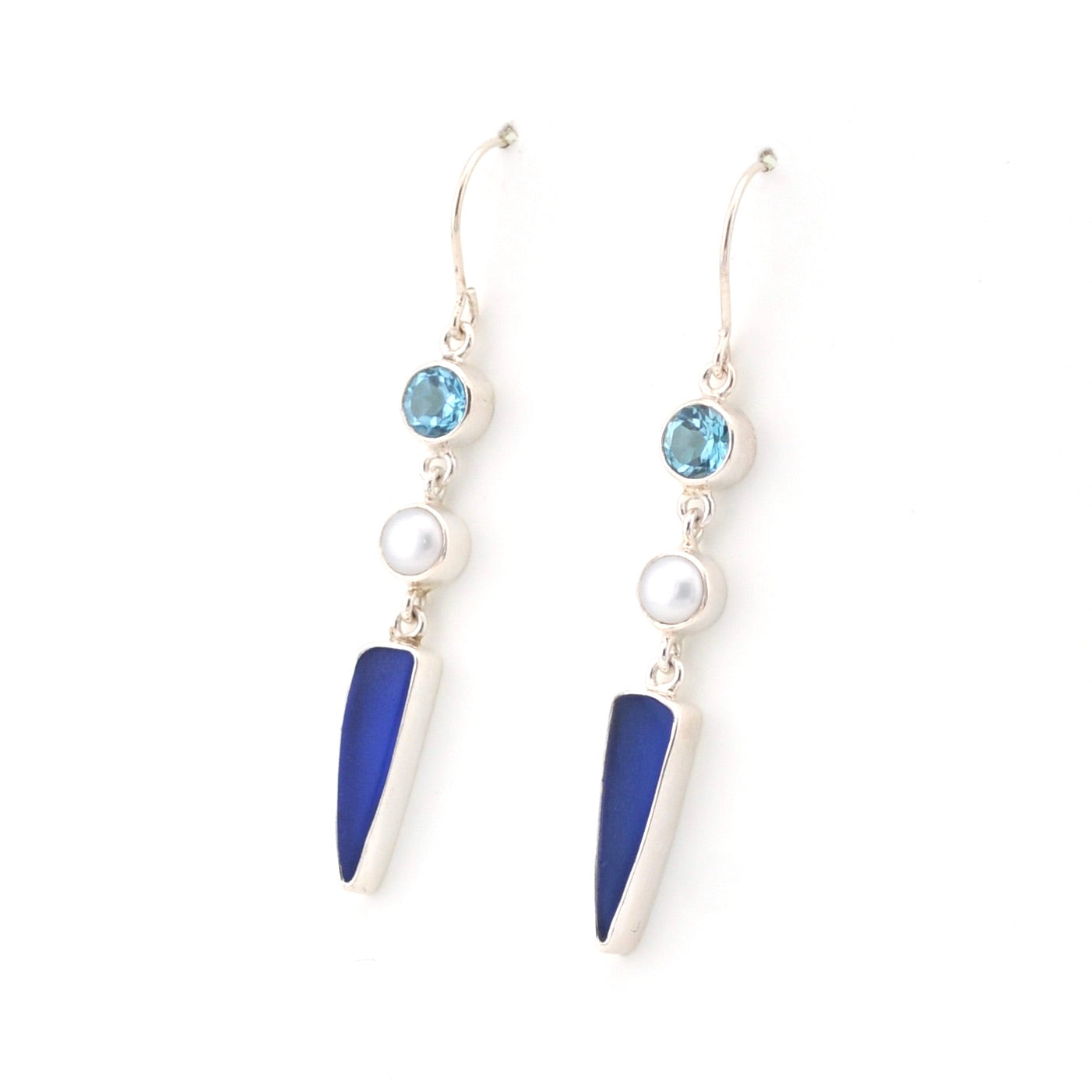 Pair of earrings with blue and white elements on a white background