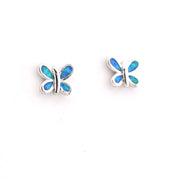 Butterfly-shaped earrings with blue opal inlay on a white background