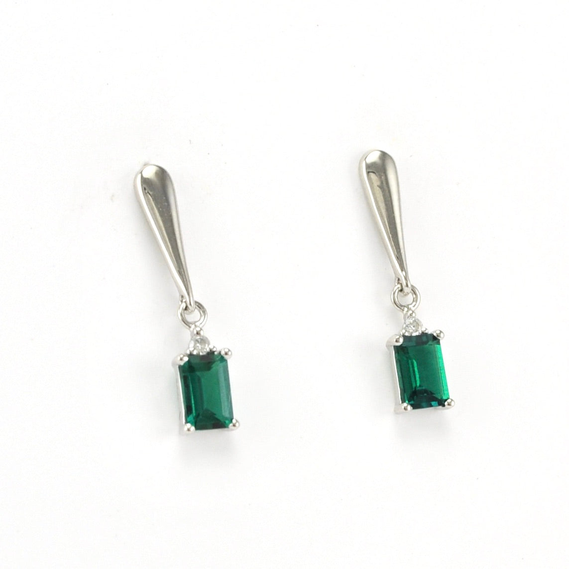 Side View Silver Created Emerald 1ct Rectangle Diamond .04ct Earrings