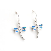 Dragonfly-shaped earrings with blue accents on a white background