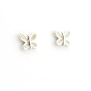 Butterfly-shaped earrings with opal-like centers on a white background