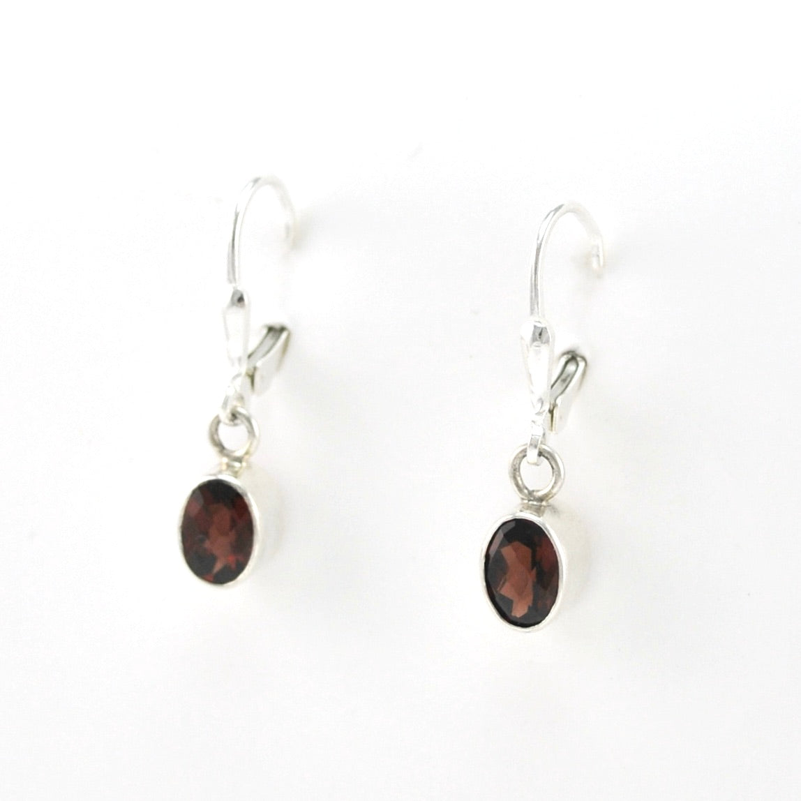 Side View Silver Garnet 5x7mm Oval Dangle Earrings