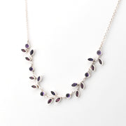 Necklace with purple gemstones on a white background