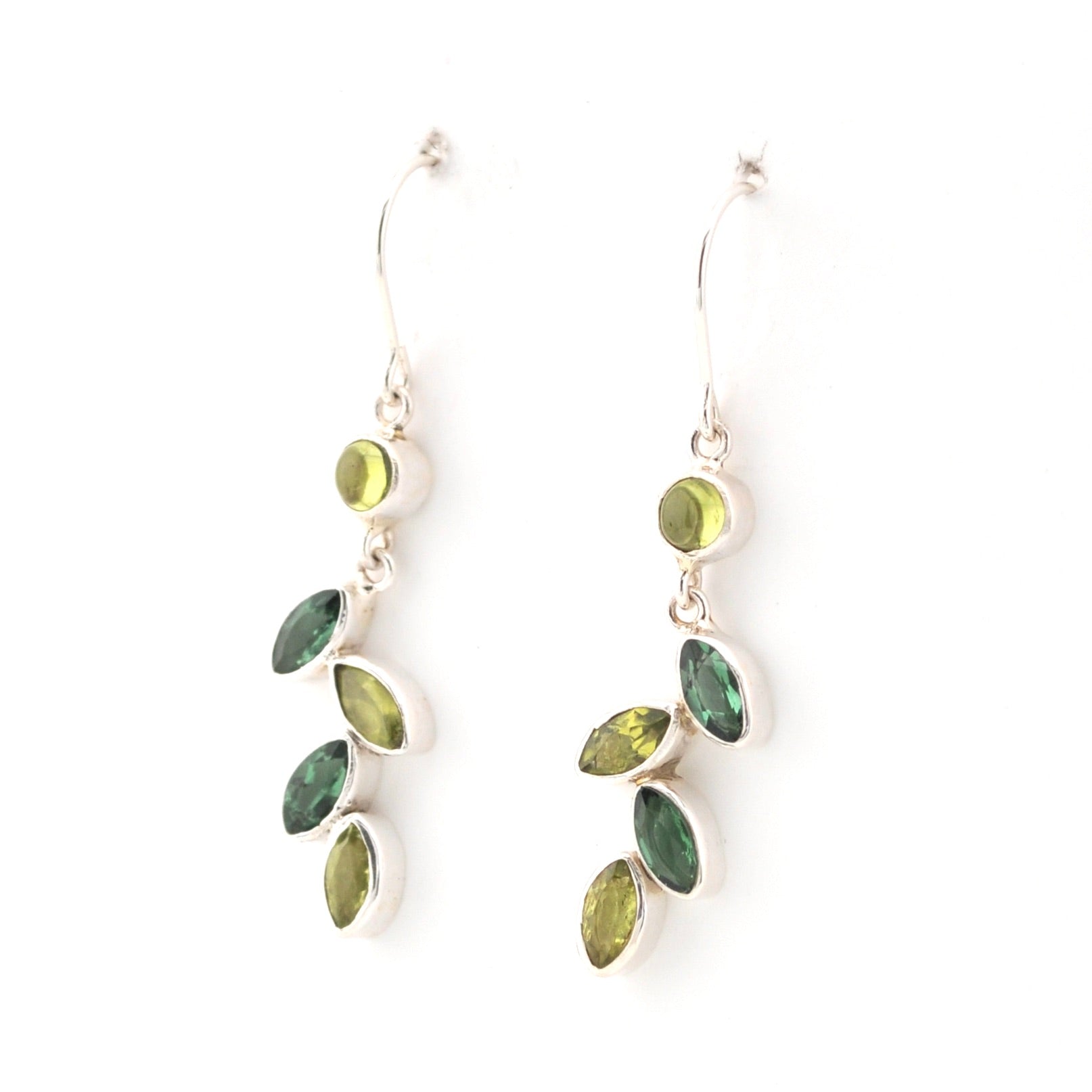 Pair of earrings with green gemstones on a white background