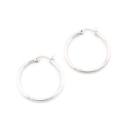Silver hoop earrings on a white background