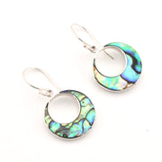Pair of earrings with circular design with abalone shell on a white background