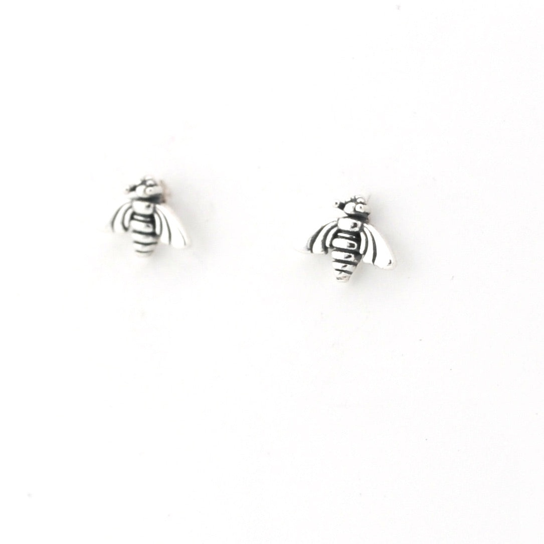 Silver bee-shaped earrings on a white background