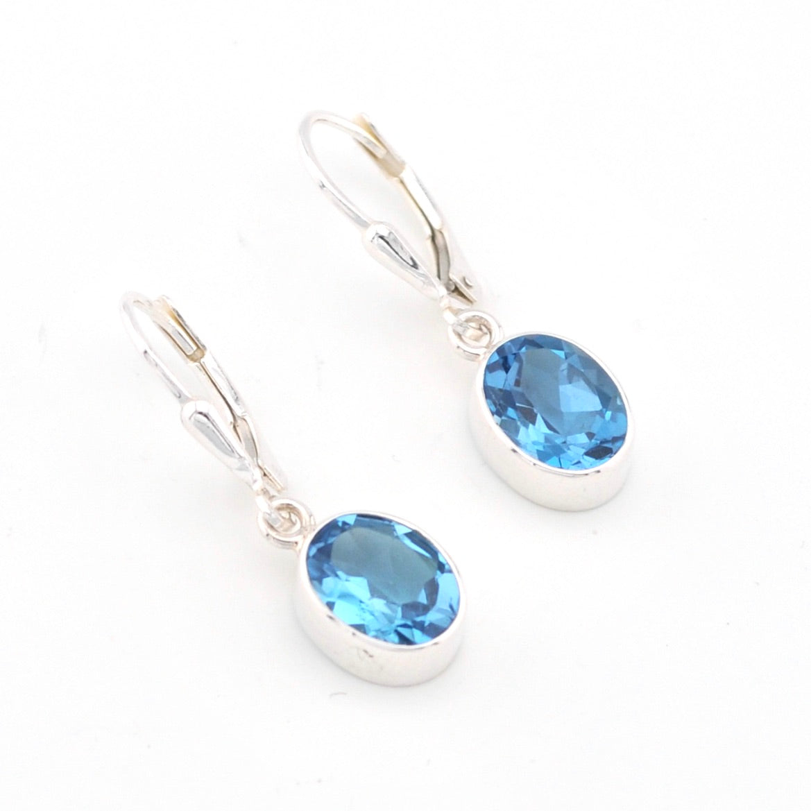 Sterling Silver Blue Topaz 7x9mm Oval Dangle Earrings