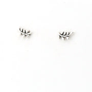 Pair of silver branch-shaped earrings on a white background